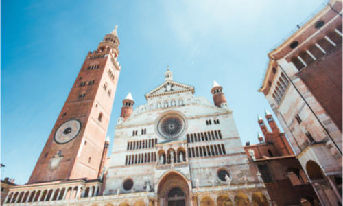 The Cathedral of Cremona photographed from below, looking up at the Torrazzo bell tower